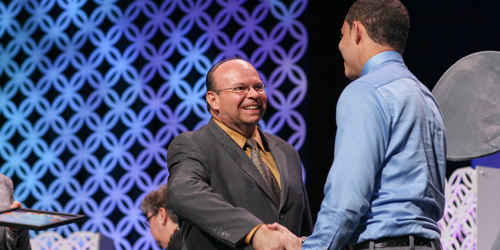 Mr. Howard shaking hands with a BLESS Certificate Recipient.